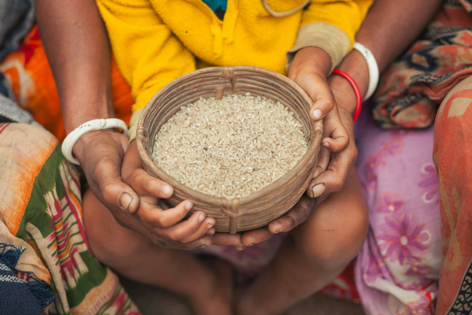 Raw long-grain rice in a woven basket